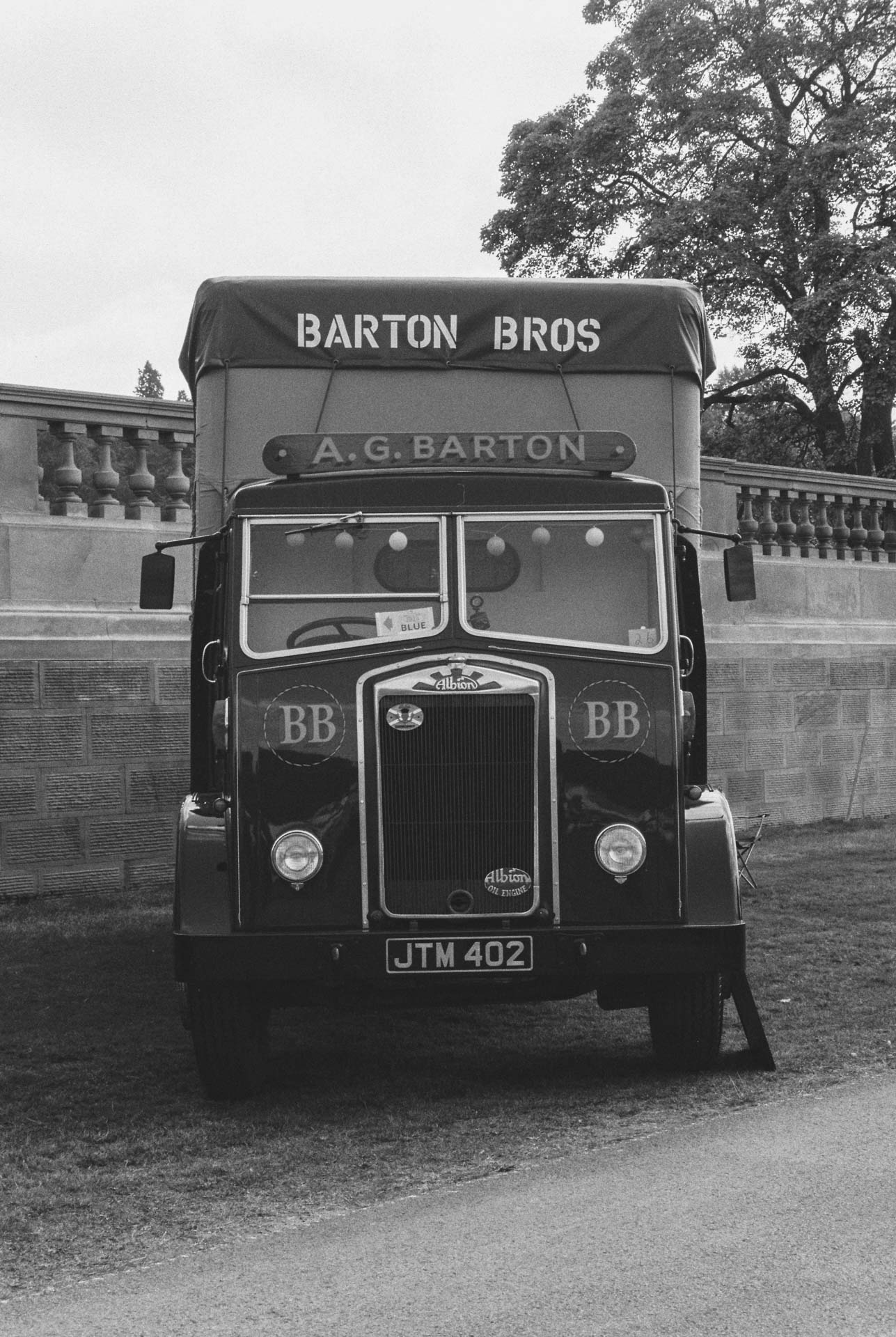 A black and white photograph of a vintage truck at Chatsworth Country Fayre, Derbyshire, The Peak District on Ilford HP5 Plus.