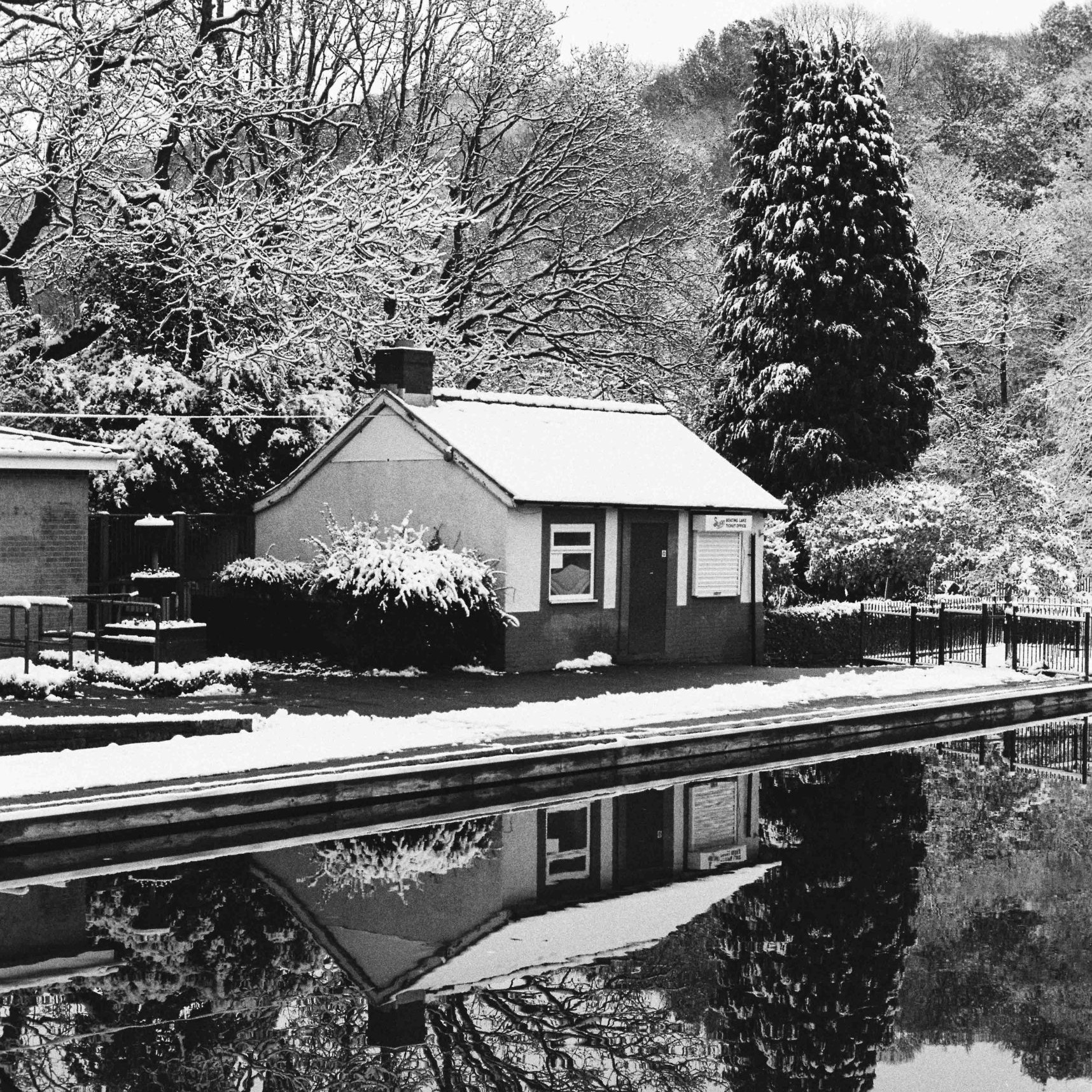 Millhouses park boating pond in the winter snow on Ilford HP5 film stock
