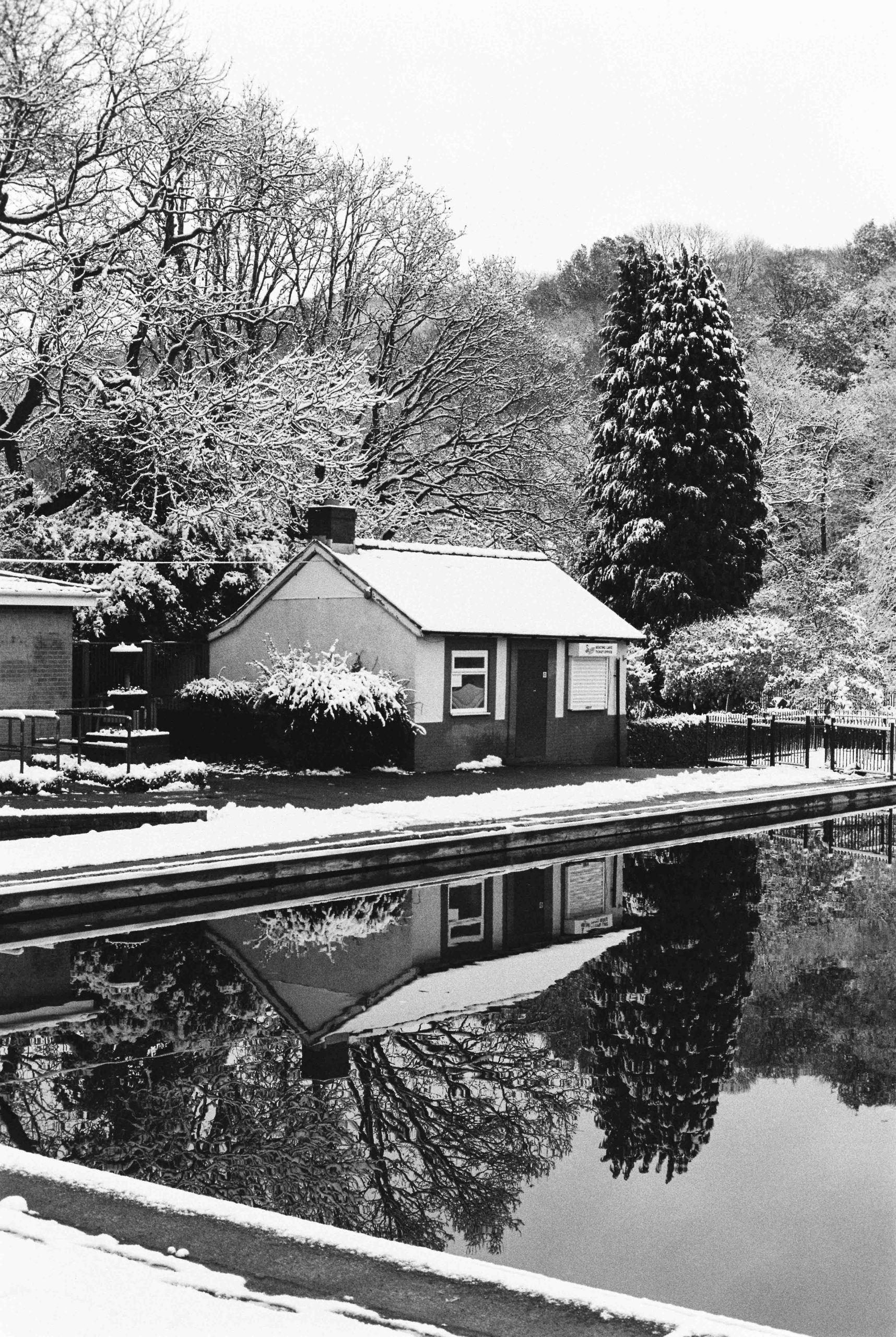 Millhouses park boating pond in the winter snow on Ilford HP5 film stock