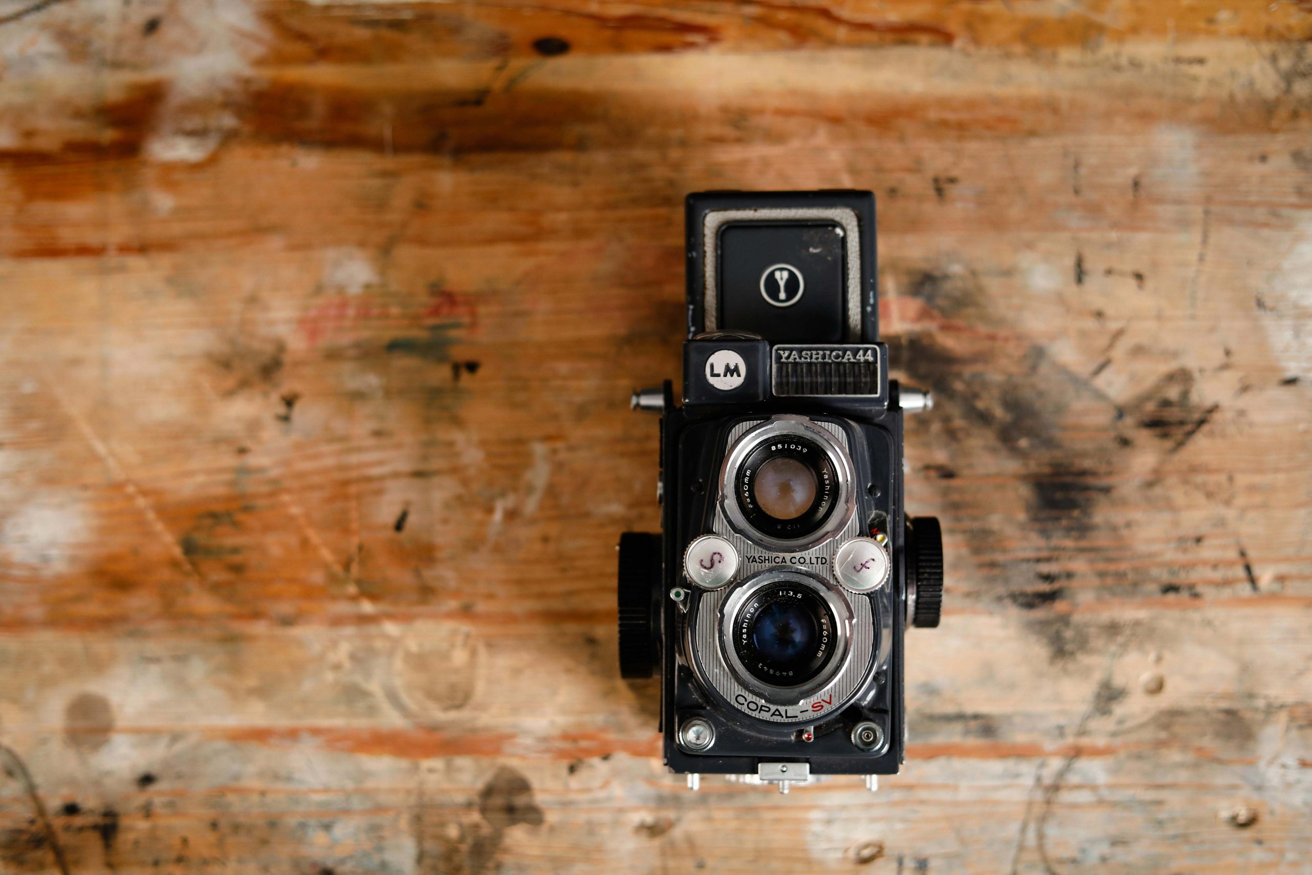 A vintage Yashica 44 TLR Camera on a wooden table