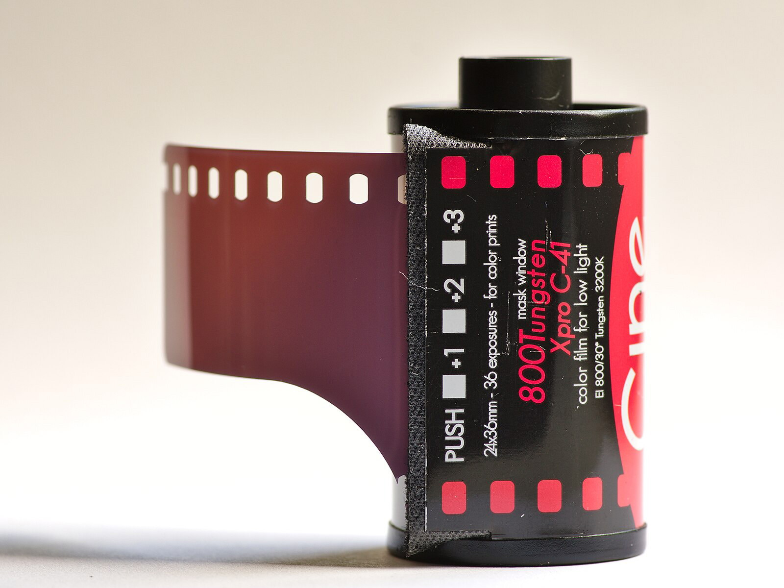 Cinestill 800 Tungsten Xpro C-41 Film Cartridge on a flat desk surface