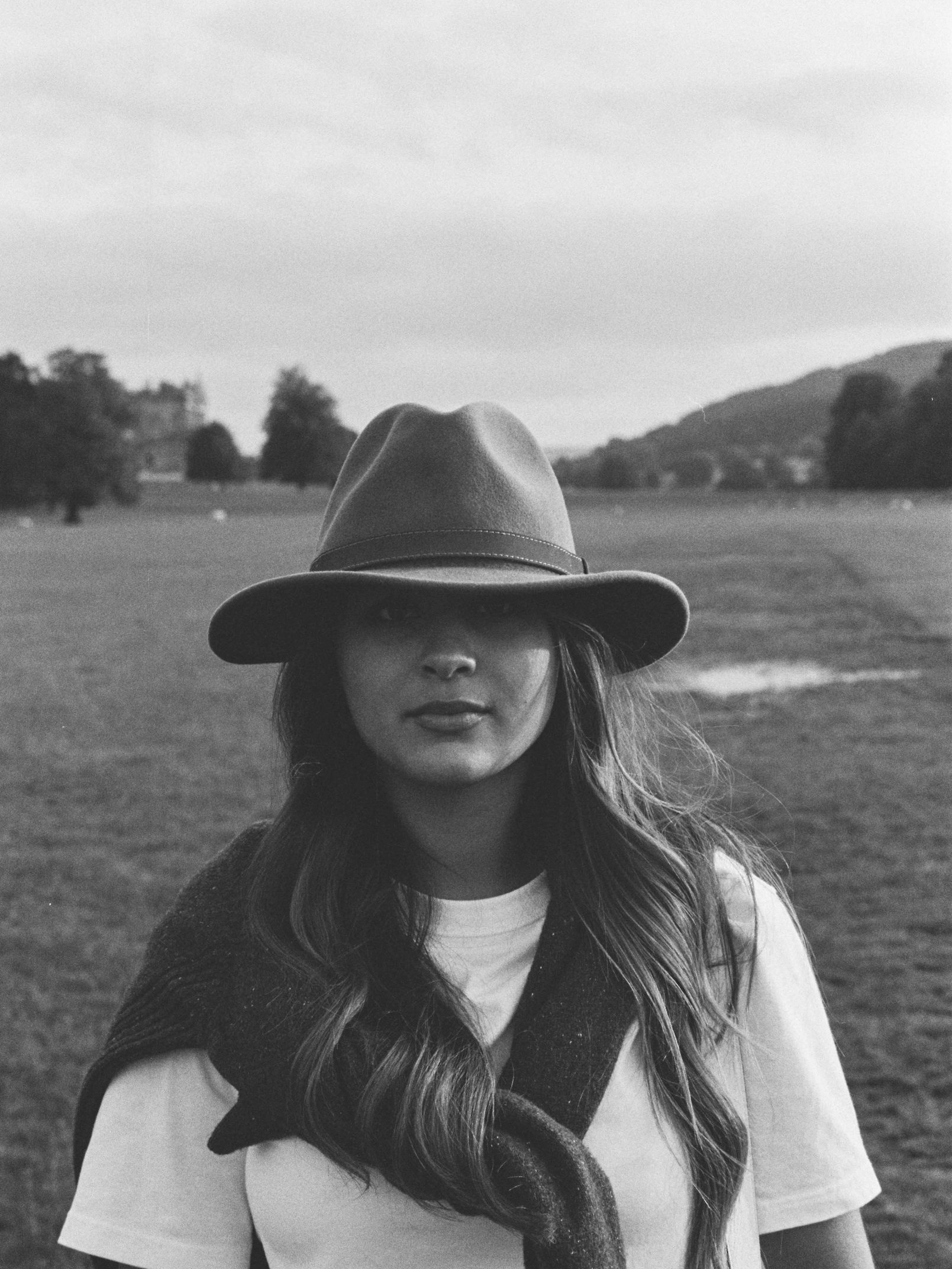 A portrait of Sara wearing a hat at Chatsworth
